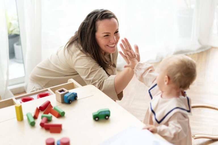 Early Childhood Assistant and child engaging in playful exploration with wooden toys