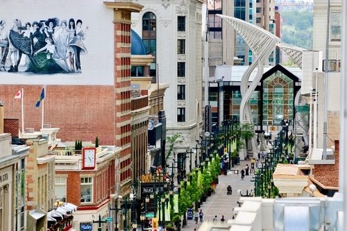 People walking on a street with buildings on both sides