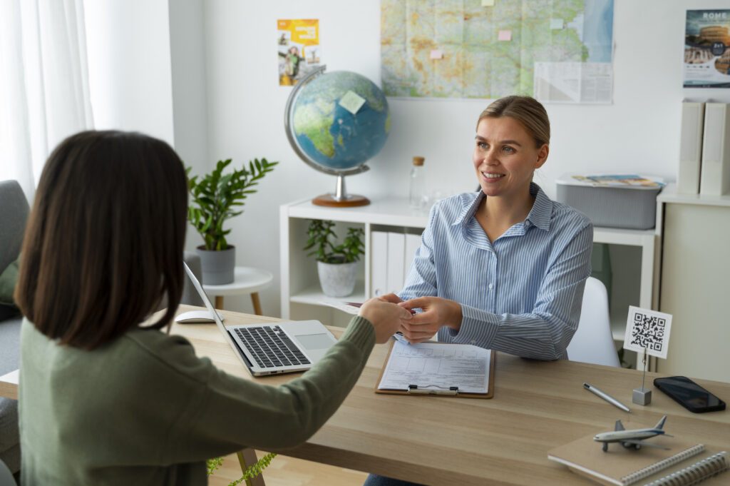 Immigration Assistant while handing passport to client