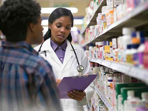 Female Pharmacist with customer